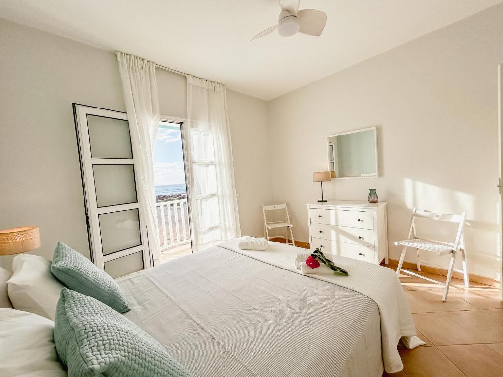 Postel nebo postele na pokoji v ubytování Papaya Apartments Boa Vista