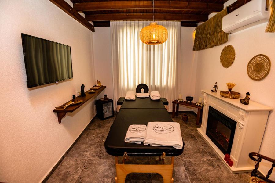 a room with a bed and a fireplace at west coast boutique hotel in Bodrum City