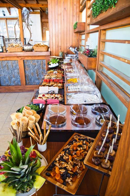 a buffet line with many different types of food at west coast boutique hotel in Bodrum City