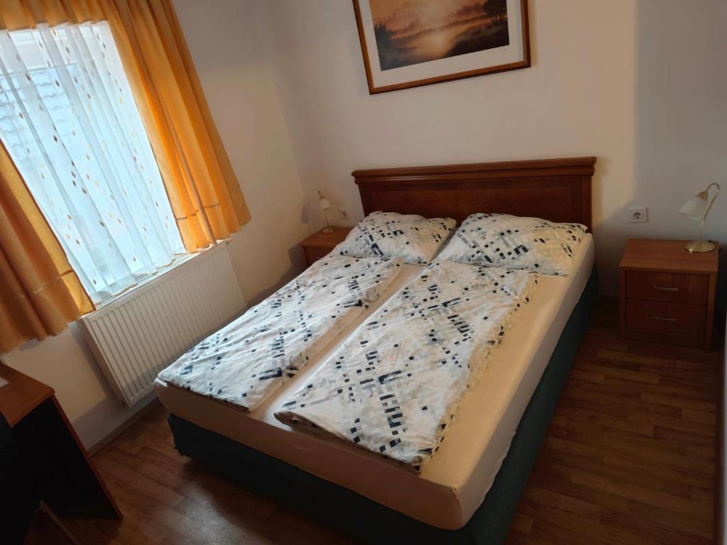 Postel nebo postele na pokoji v ubytování Apartmaji Pri Kokolu