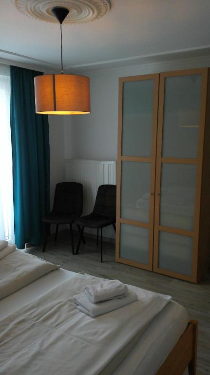 Postel nebo postele na pokoji v ubytování BORA Appartements Zell am See
