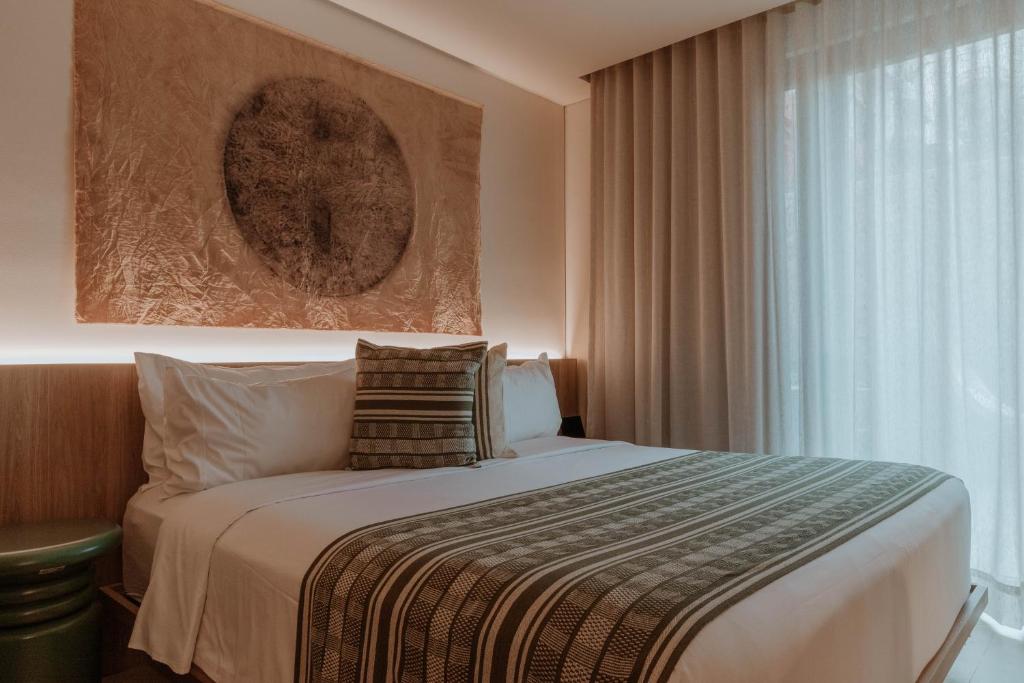 Een bed of bedden in een kamer bij Osh Hotel Cartagena