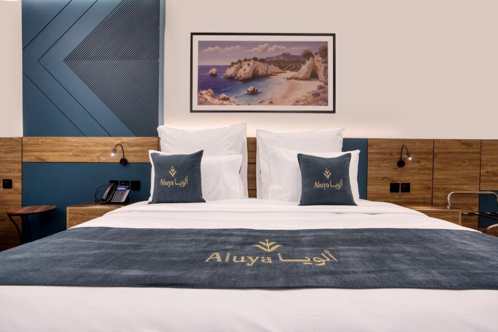 Postel nebo postele na pokoji v ubytování Aluya Hotel