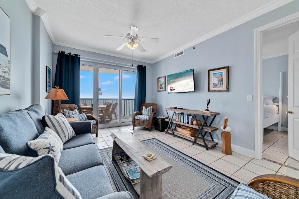 a living room with a couch and a table at Island Royale 701 in Gulf Shores