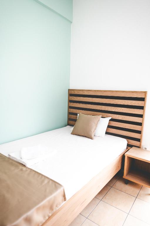 Łóżko lub łóżka w pokoju w obiekcie Μpasias Apartments