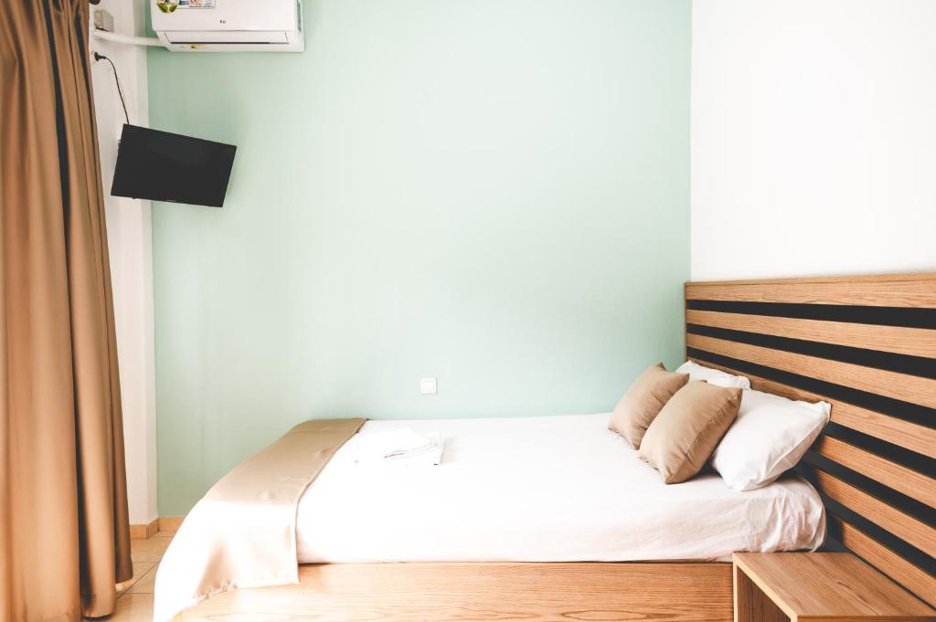 Łóżko lub łóżka w pokoju w obiekcie Μpasias Apartments