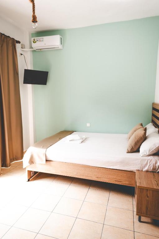 Łóżko lub łóżka w pokoju w obiekcie Μpasias Apartments