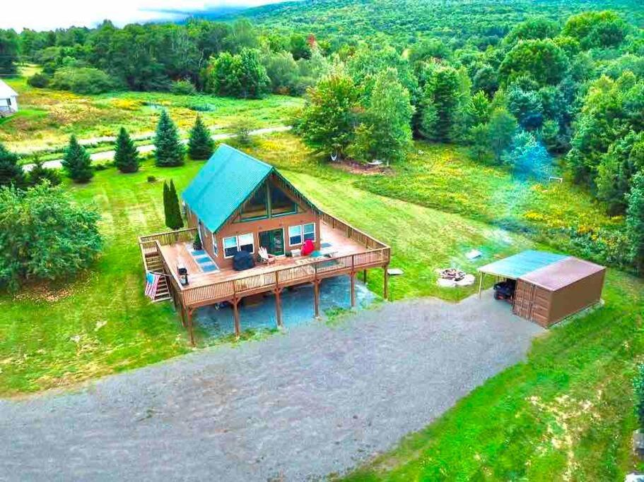 an overhead view of a tiny house with a blue roof at Journeys End Chalet - Minutes to Jay Peak! in Jay