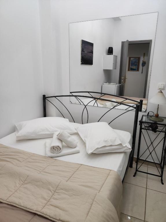 Postel nebo postele na pokoji v ubytování Porto Chania