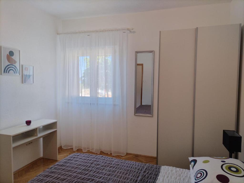 Postel nebo postele na pokoji v ubytování Apartments Podbarje