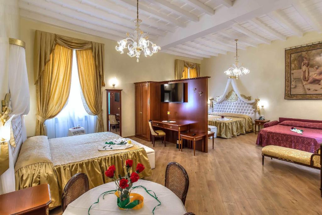 Posteľ alebo postele v izbe v ubytovaní Trevi Rome Suite