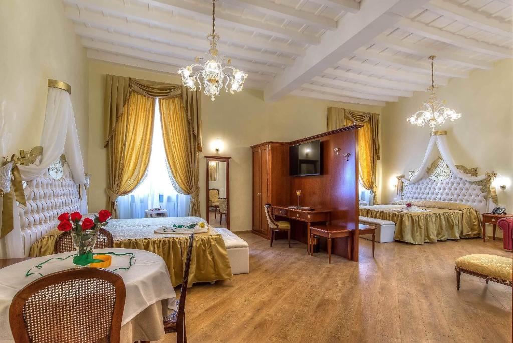 Posteľ alebo postele v izbe v ubytovaní Trevi Rome Suite