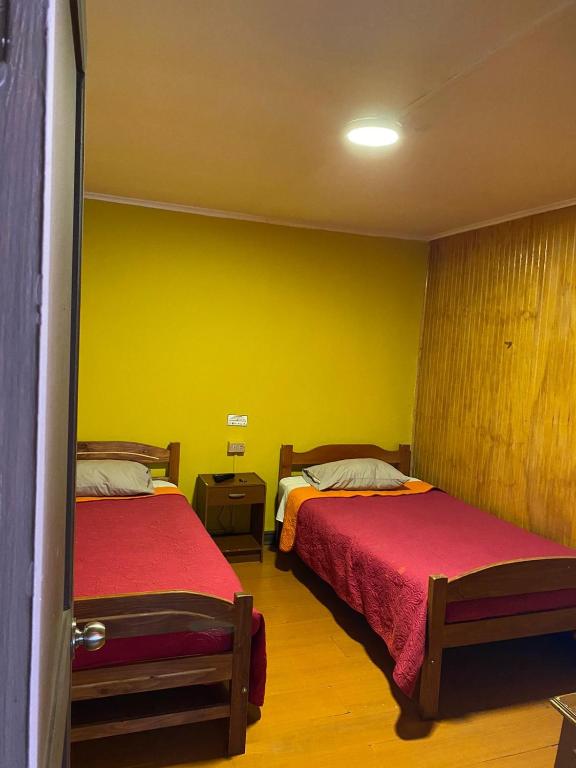 Letto o letti in una camera di Hostal Radal Molina