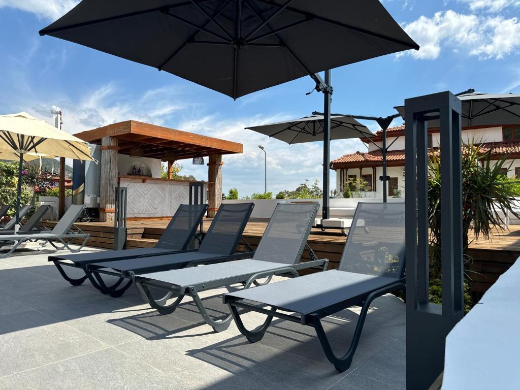 A patio or other outdoor area at Tomsan Suites & Villas Akyaka
