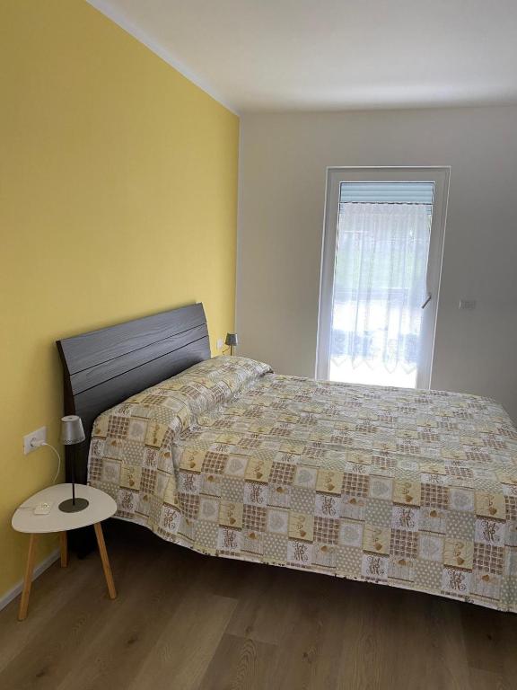 Postel nebo postele na pokoji v ubytování Lotus Garda