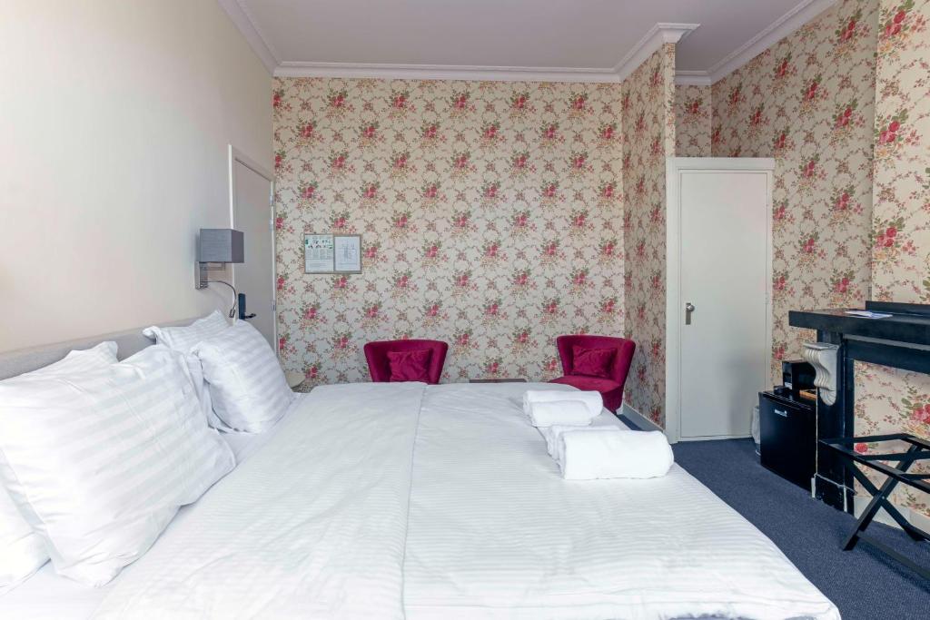 Postel nebo postele na pokoji v ubytování Hotel Rubenshof