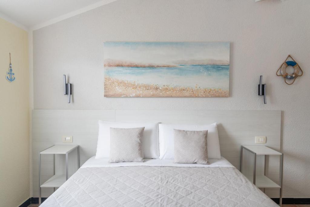 Een bed of bedden in een kamer bij B&B Vignola