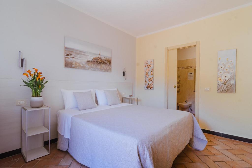 Een bed of bedden in een kamer bij B&B Vignola