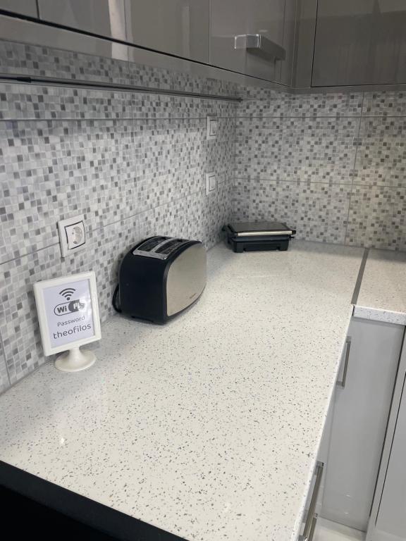 Kuchyň nebo kuchyňský kout v ubytování Theofilos apartment