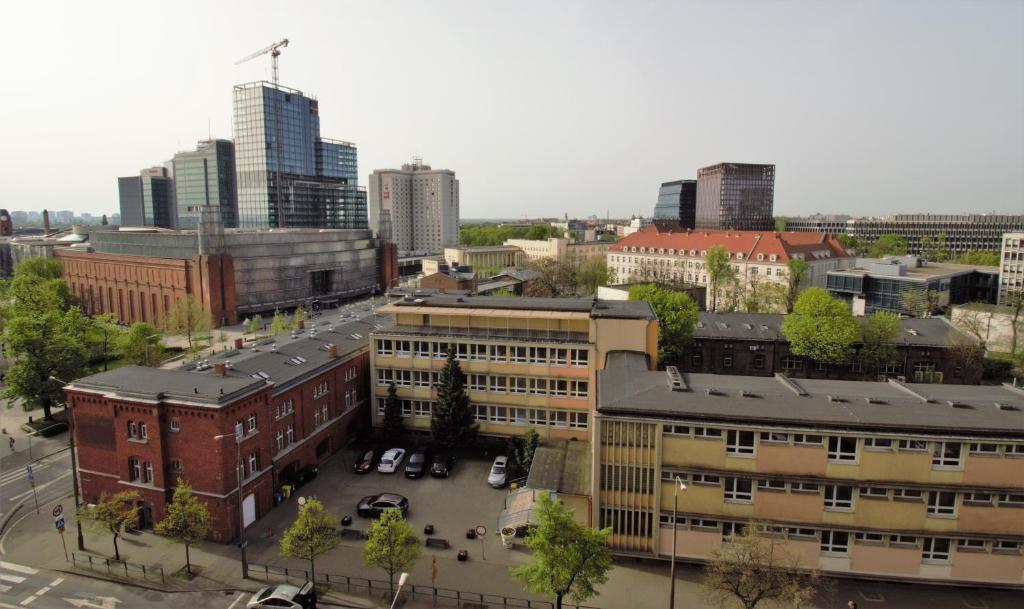 an aerial view of a city with tall buildings at roomspoznan pl - Powstancow Wielkopolskich 23 - 24h self check-in in Poznań