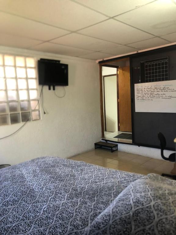 TV a/nebo společenská místnost v ubytování El Hogar de Carmelita