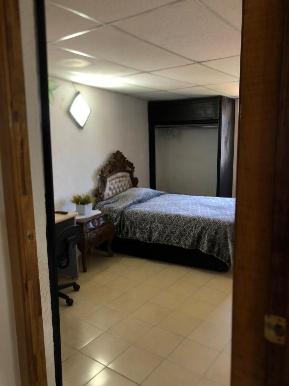 Postel nebo postele na pokoji v ubytování El Hogar de Carmelita