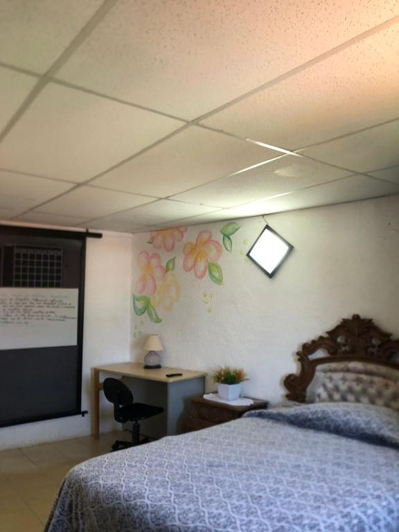 Postel nebo postele na pokoji v ubytování El Hogar de Carmelita