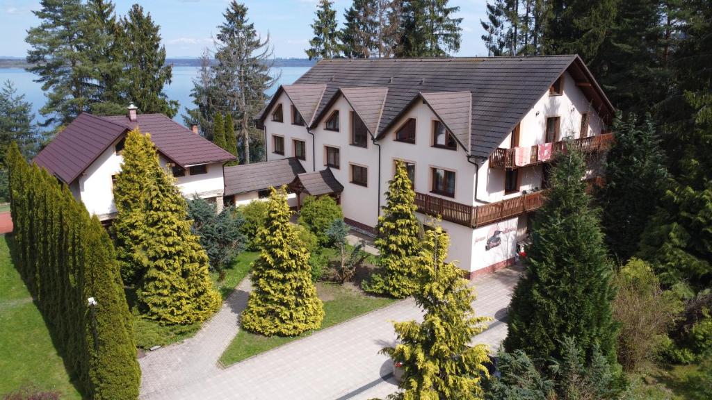 an aerial view of a house with trees at Penzion Kormoran in Námestovo