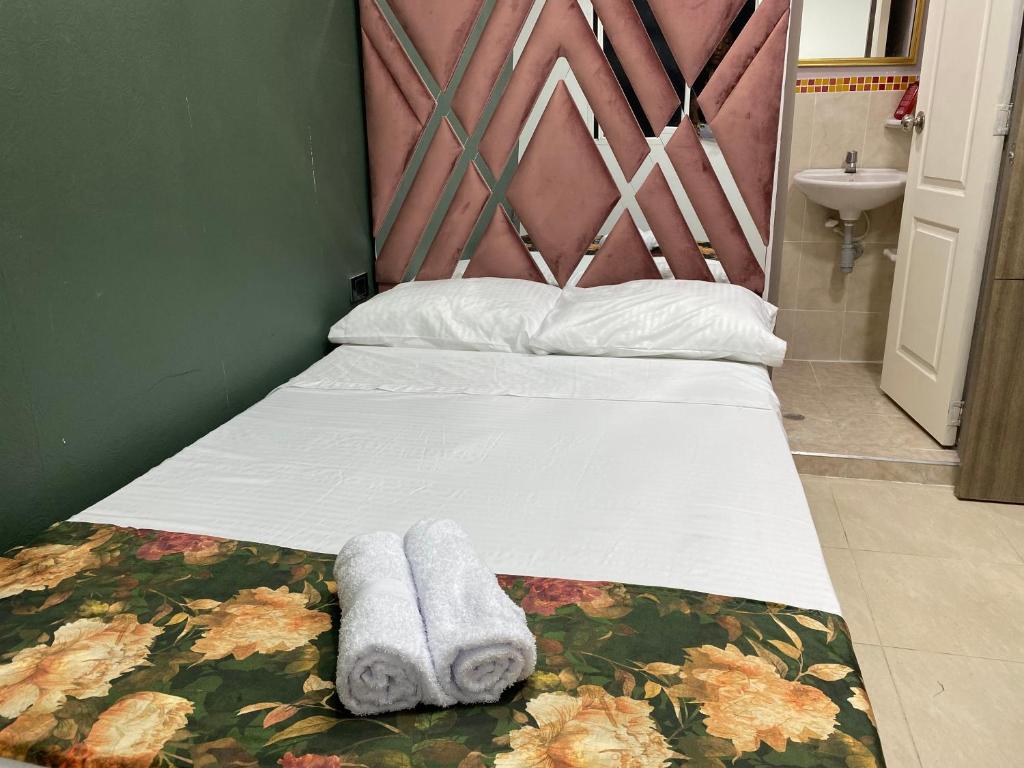 Una cama o camas en una habitación de Casa Mango