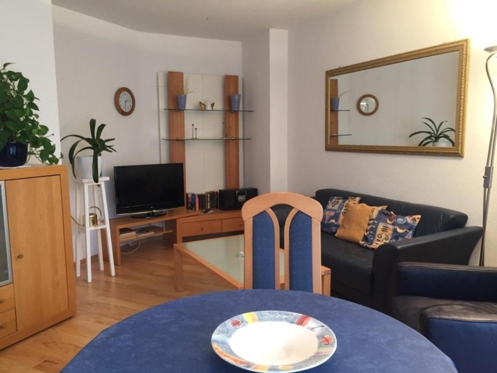a living room with a couch and a table at Ferienwohnung Kurringblick 938 in Bad Rodach