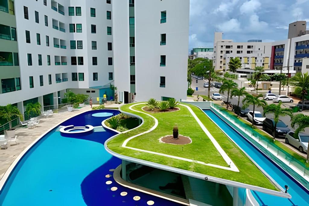 arial view of a building with a swimming pool at Aptos no Luxor Tambaú próximo ao mar in João Pessoa