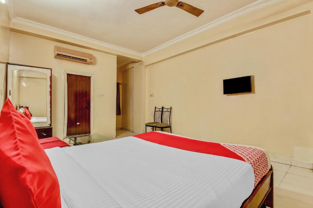 a bedroom with a bed and a ceiling fan at Sahasra Residency 43619 Near Nexus Hyderabad in Hyderabad