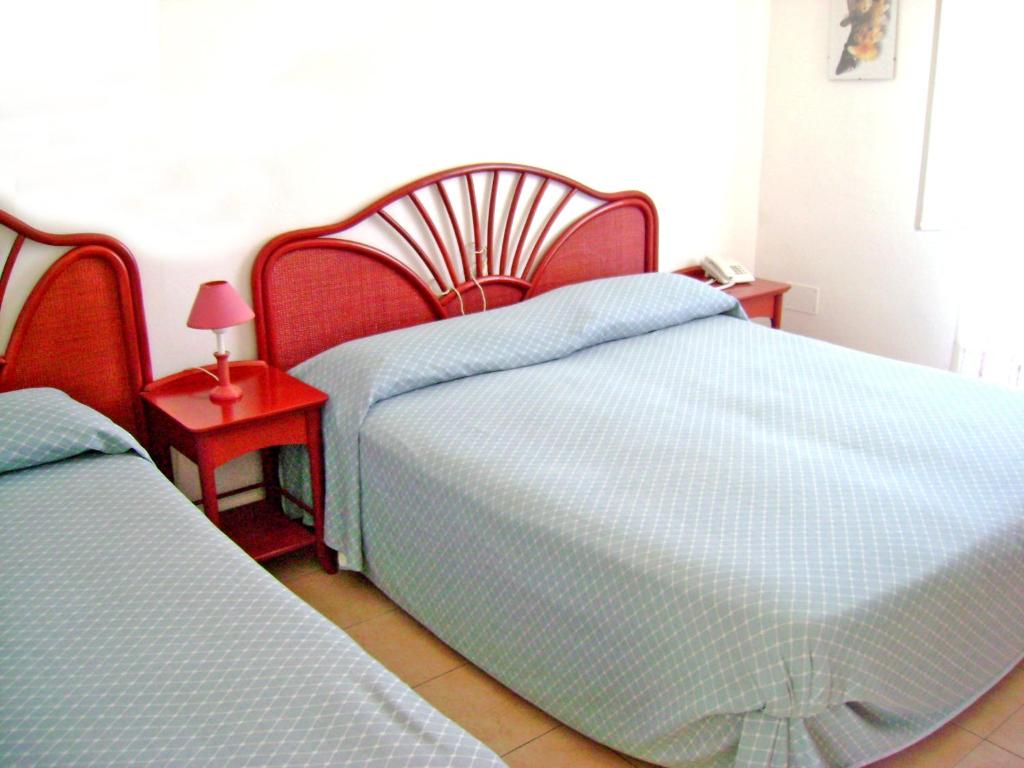 Postel nebo postele na pokoji v ubytování Hotel Scoglio Bianco