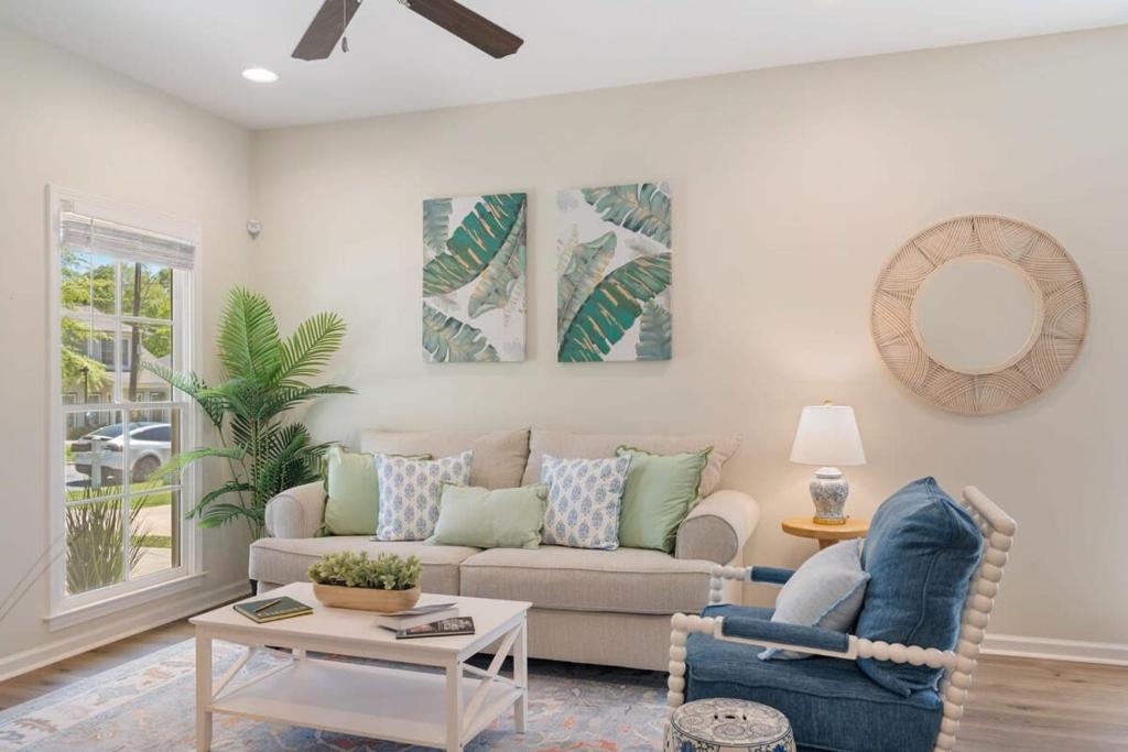 a living room with a couch and a table at Single Story Fire Pit Updated Close to Downtown in Columbus