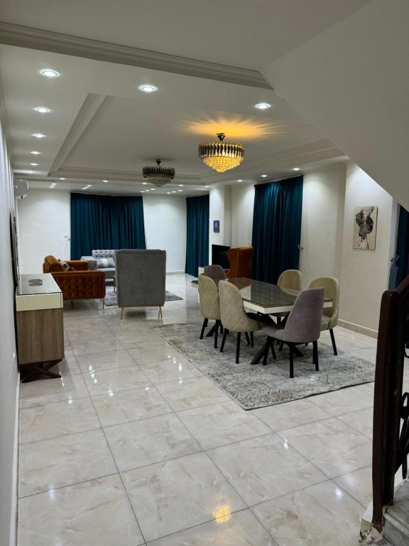 a dining room with a table and chairs at 4شارع نبلس المهندسين in Cairo
