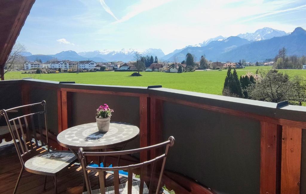 a table and chairs on a balcony with a view at Cozy Apartment In Puch Bei Hallein With Kitchen in Puch bei Hallein