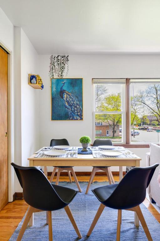 a dining room with a table and chairs at Curated for Cozy Longer Stays in Westmont
