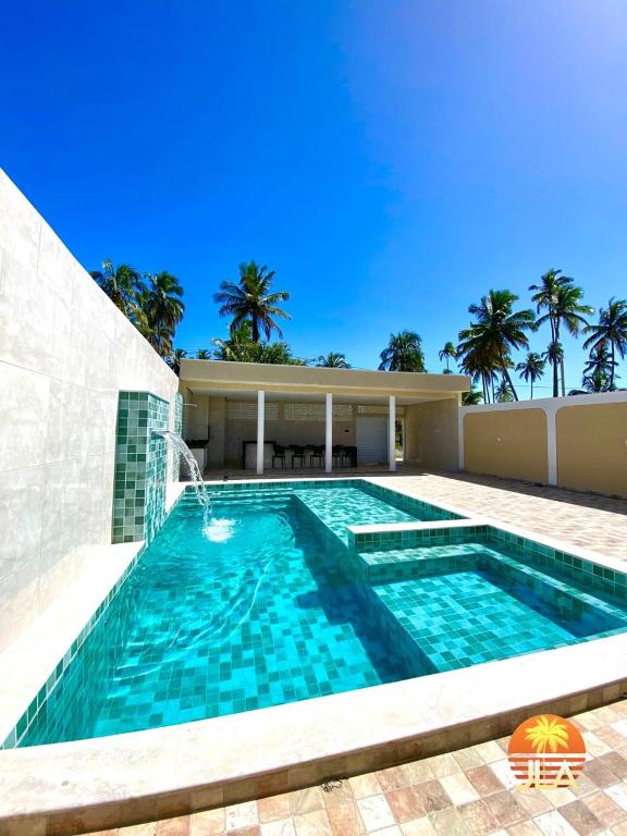 een zwembad voor een huis bij Casa em Paripueira, conforto e privacidade in Paripueira