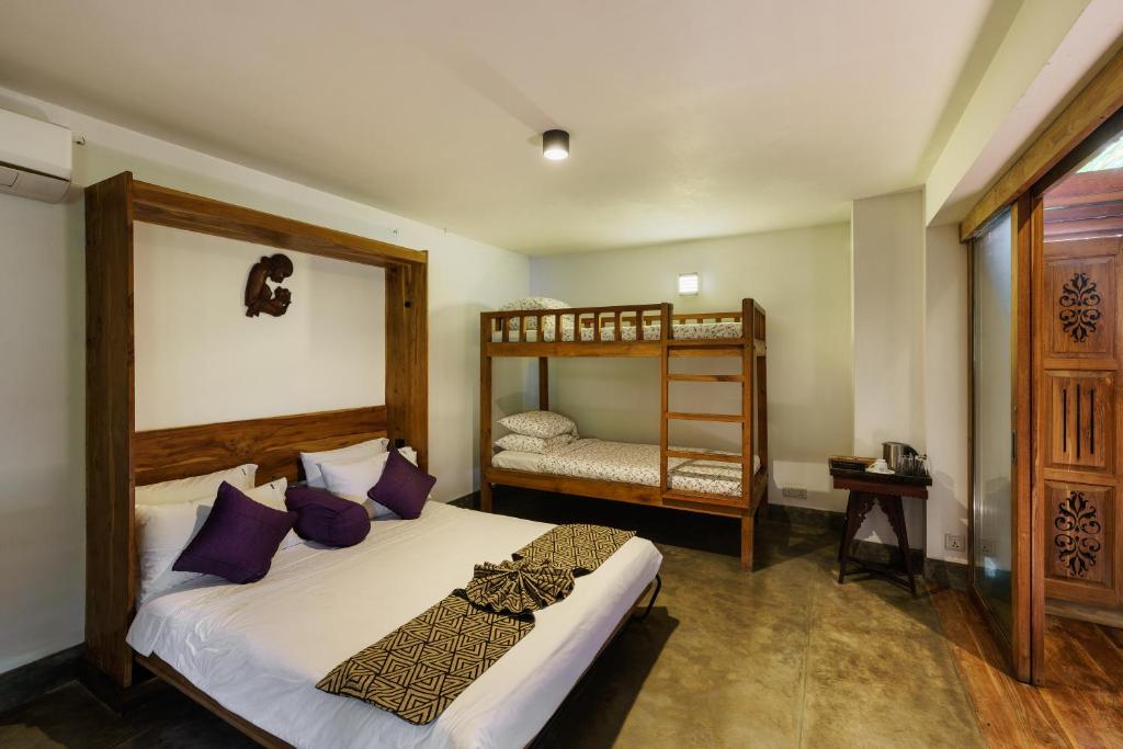 Postel nebo postele na pokoji v ubytování Royal Indigo Villa