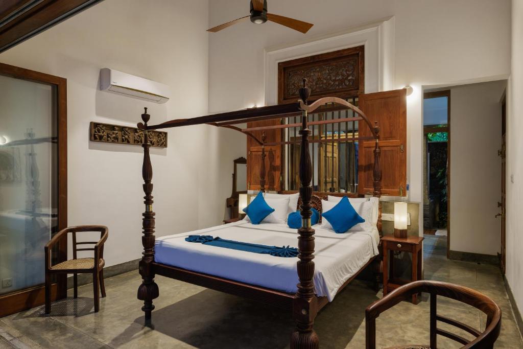 Postel nebo postele na pokoji v ubytování Royal Indigo Villa