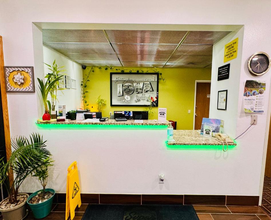a shop with a counter in a room at Forest City Inn in Forest City