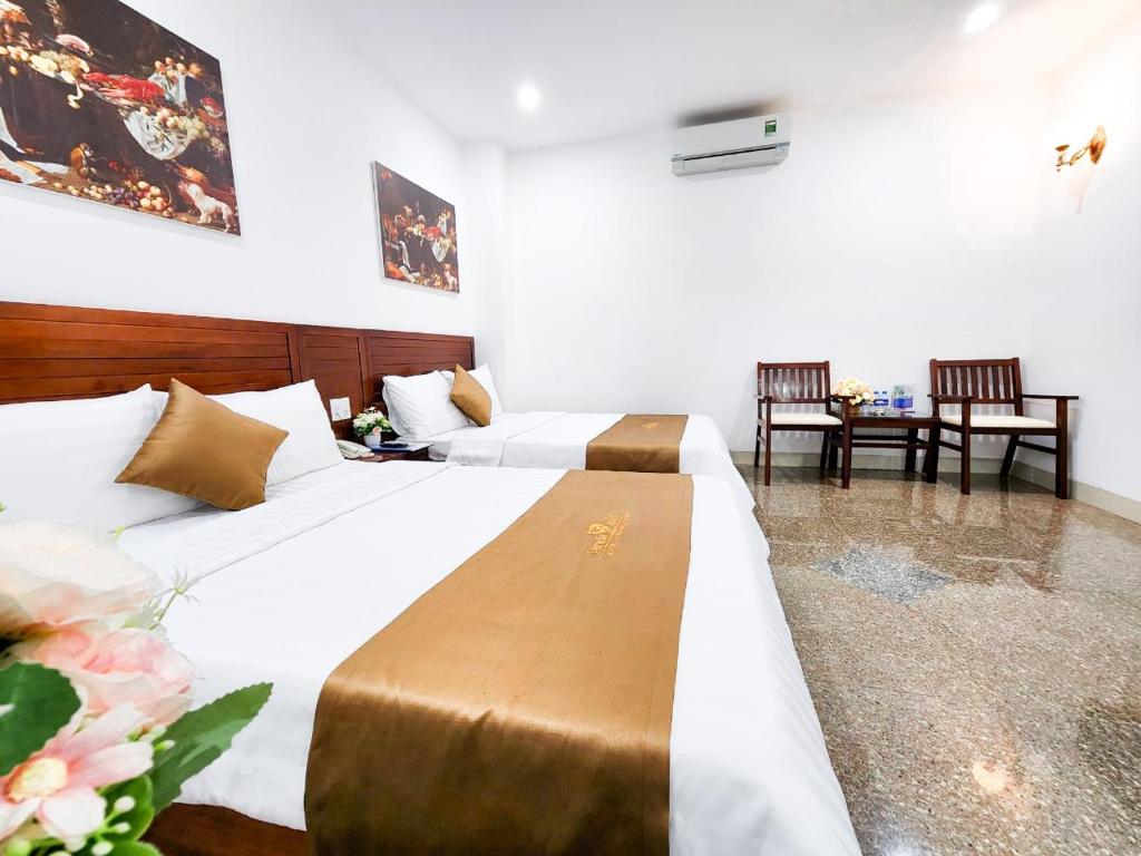 Säng eller sängar i ett rum på Paradis Hotel Quy Nhon