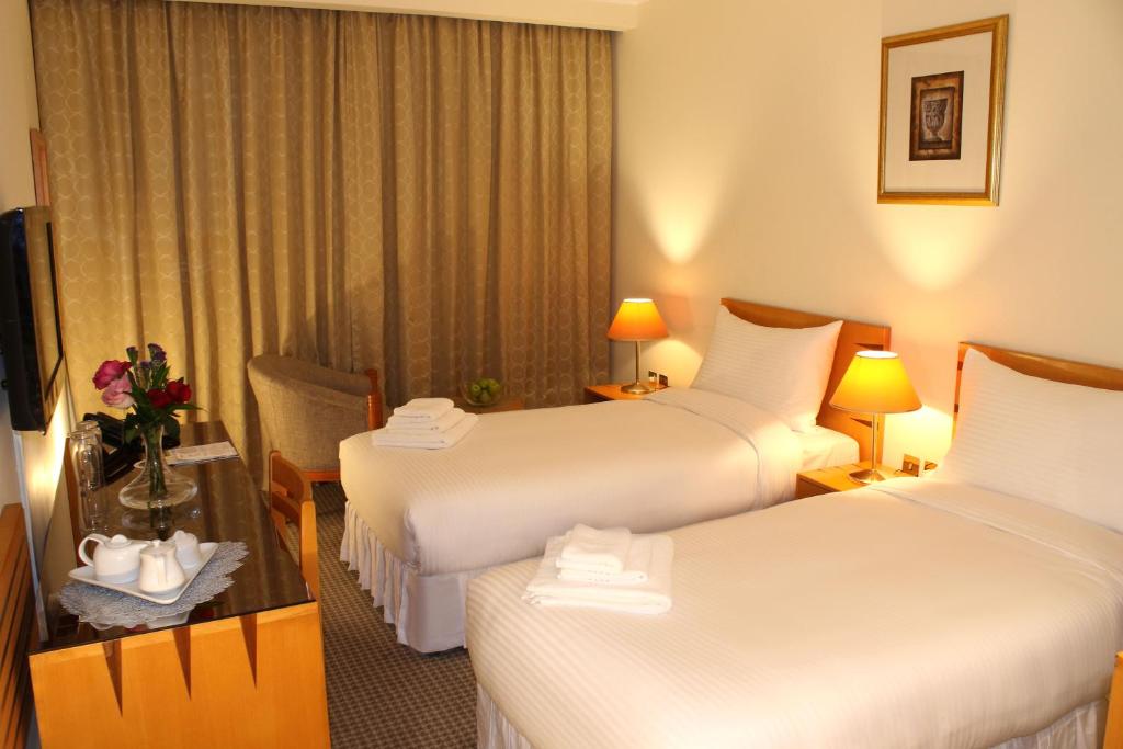 Posteľ alebo postele v izbe v ubytovaní Swiss-Belinn Doha