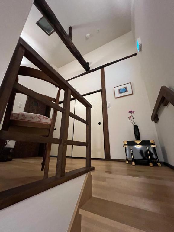 Postel nebo postele na pokoji v ubytování Imakumano Terrace - Kenzan An 乾山庵