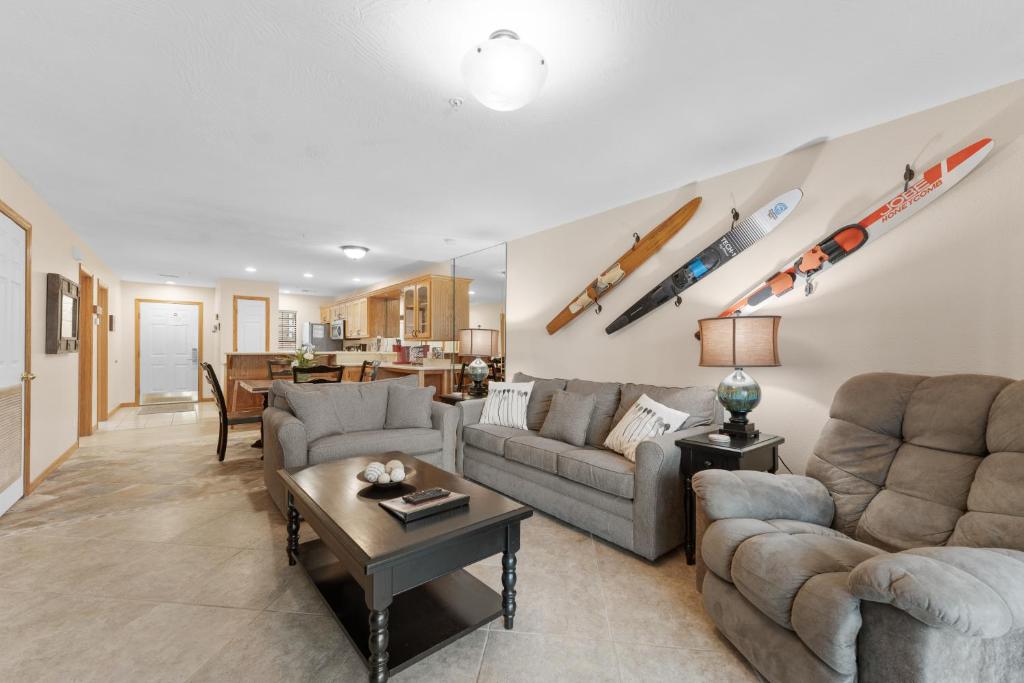 a living room with two couches and a table at Dog-Friendly Quiet Cove Condo in Hollister