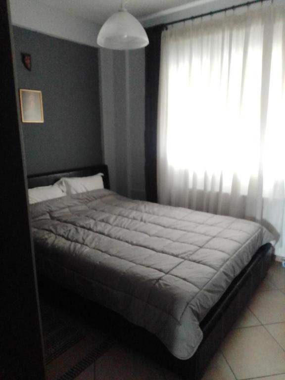 Postel nebo postele na pokoji v ubytování SOFI APARTMENT
