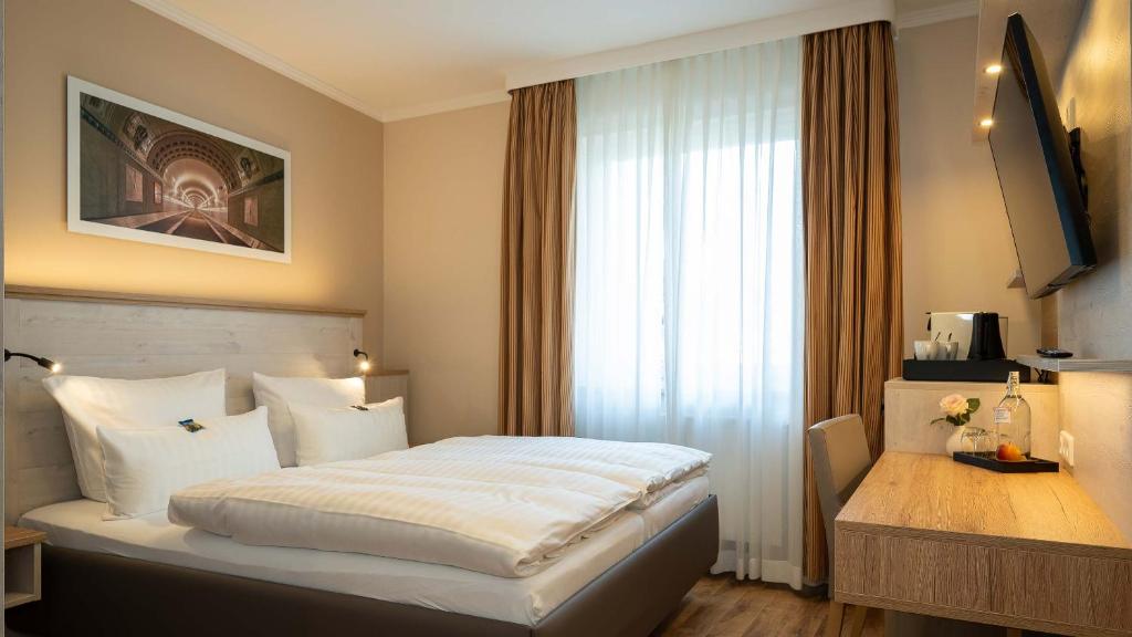 Postel nebo postele na pokoji v ubytování Hotel Rosengarten