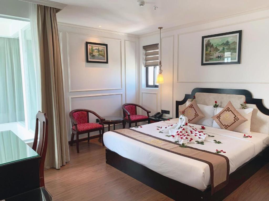 Postel nebo postele na pokoji v ubytování Coecco Xieng Khouang Hotel