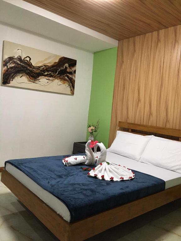 Postel nebo postele na pokoji v ubytování GBU Loboc River Guesthouse