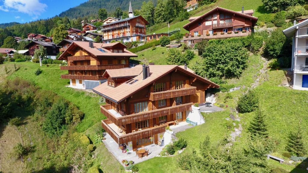 an aerial view of a house on a hill at Chalet Panorama 1 in Wengen